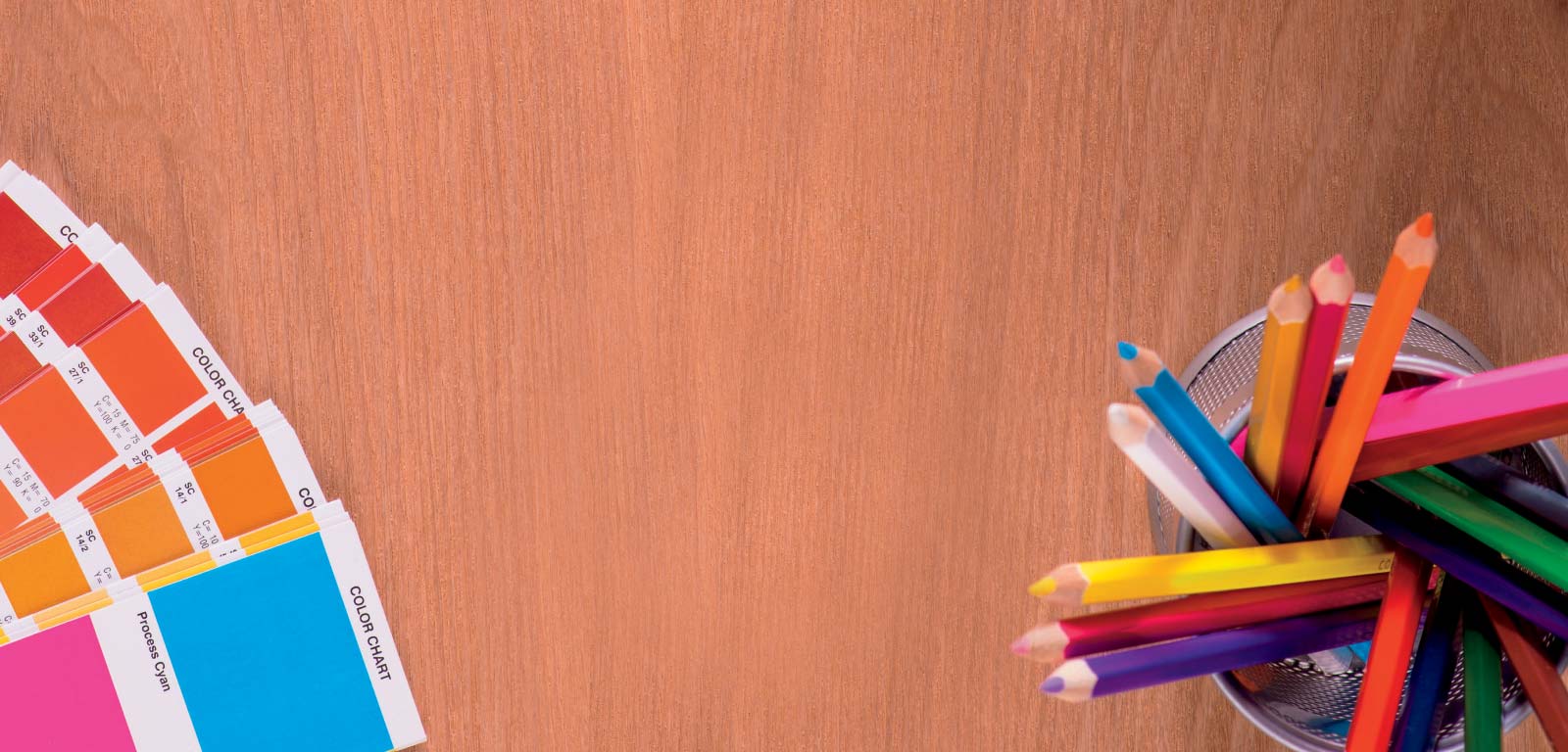Color swatches and colored pencils on a desktop