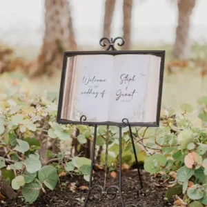 Welcome sign in forest that looks like a book